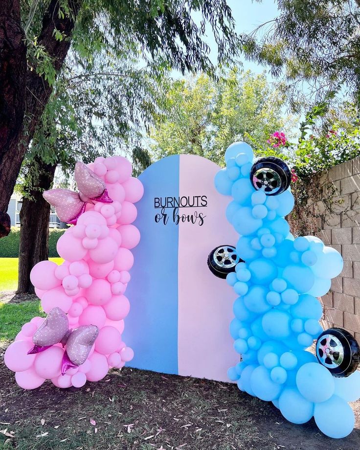 balloons are arranged in the shape of cars on display at burnout's birthday party