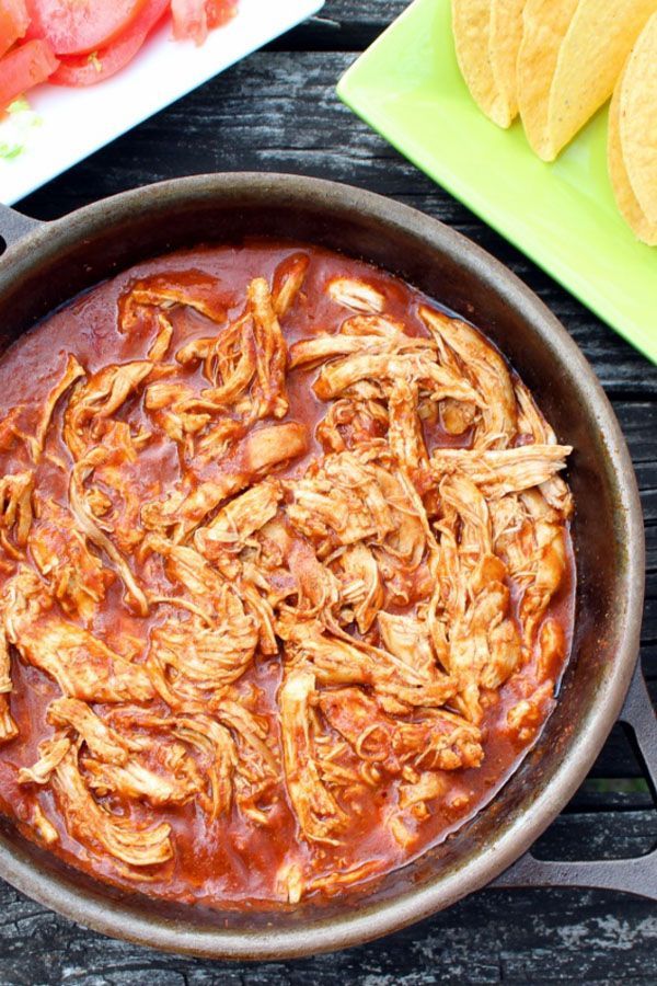 a skillet filled with sauce and tortilla chips