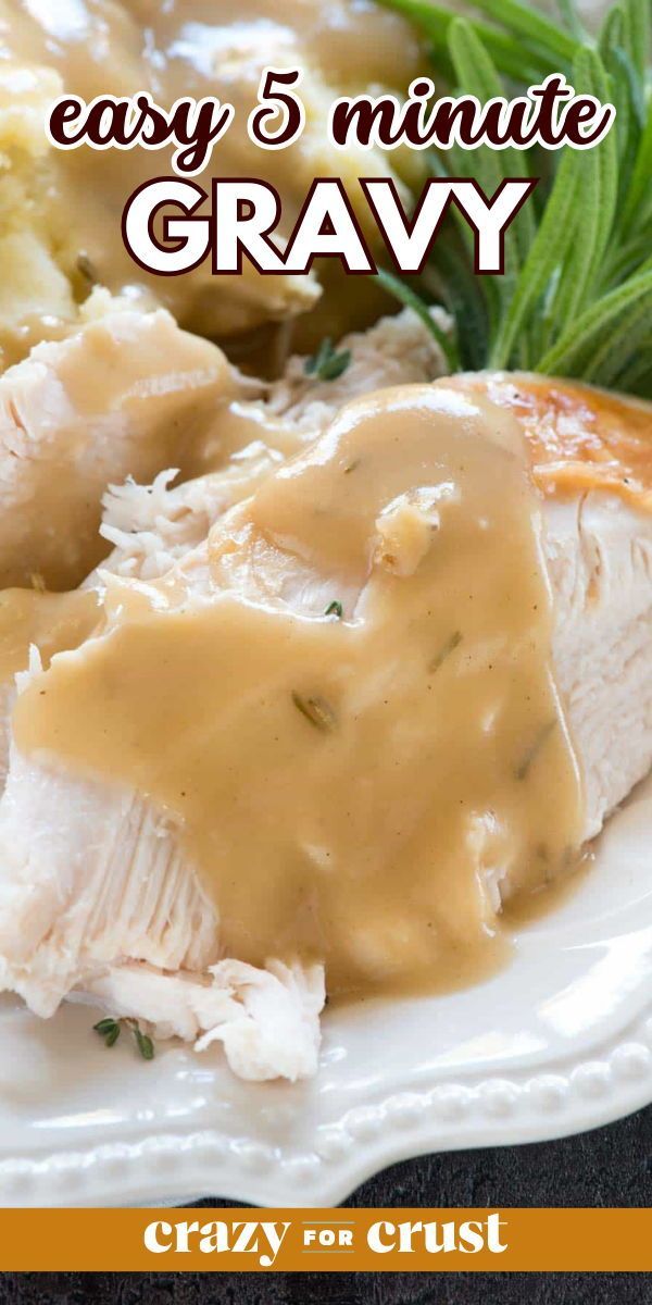 a white plate topped with chicken covered in gravy