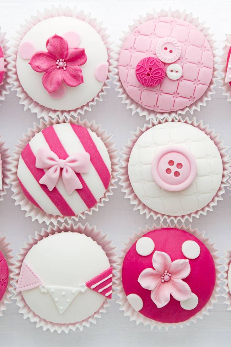 cupcakes decorated with pink and white icing