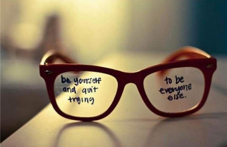 a pair of glasses with words written on the lens and one saying be yourself and not everyone else