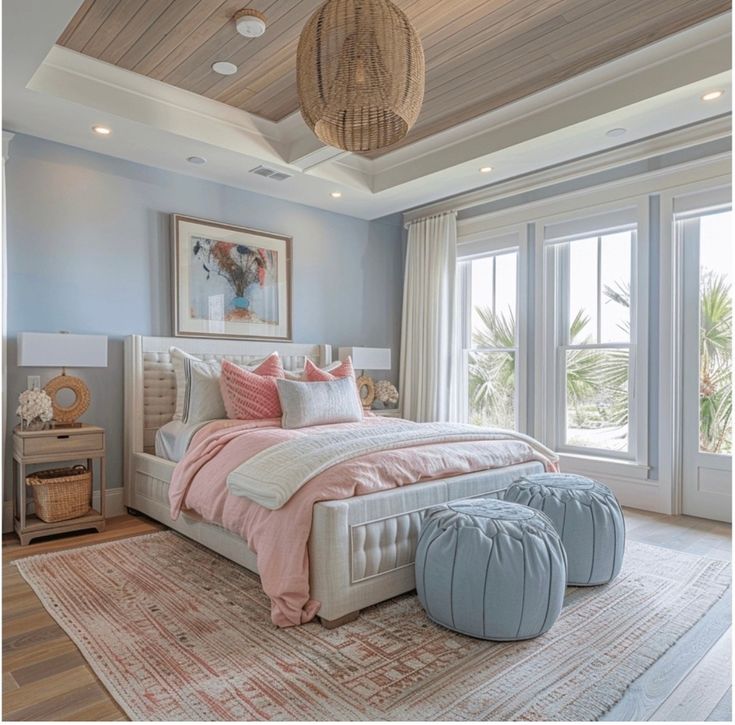 a bedroom with blue walls and white furniture