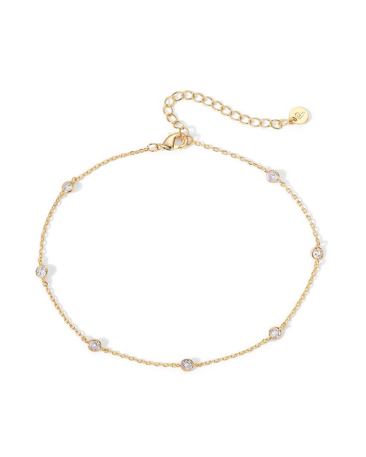 PRICES MAY VARY. Experience the allure of summer with our anklet. This 9-inch anklet with a 2-inch extender finished with a lobster clasp will elegantly drape around your foot. Its unique design, with shimmering 3mm premium AAAAA cubic zirconia and delicate link chains, transforms your look into a testament of timeless love and beauty. The anklet is plated in 14k yellow gold plating that ensures a long-lasting finish that will keep its shine through your summer adventures. This women's jewelry p Anklets For Women, Anklet Designs, Timeless Love, Gold Anklet, Chain Anklet, Summer Adventures, Anklet Jewelry, Ankle Bracelets, Everyday Jewelry