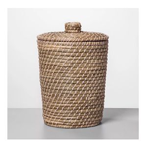 a large woven basket with a lid on the top is shown in front of a white background