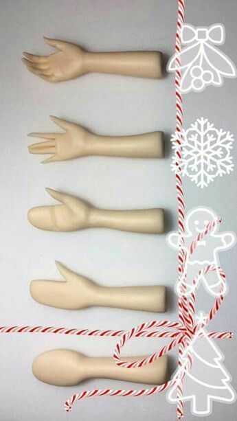 four wooden doll hands tied with twine and candy canes