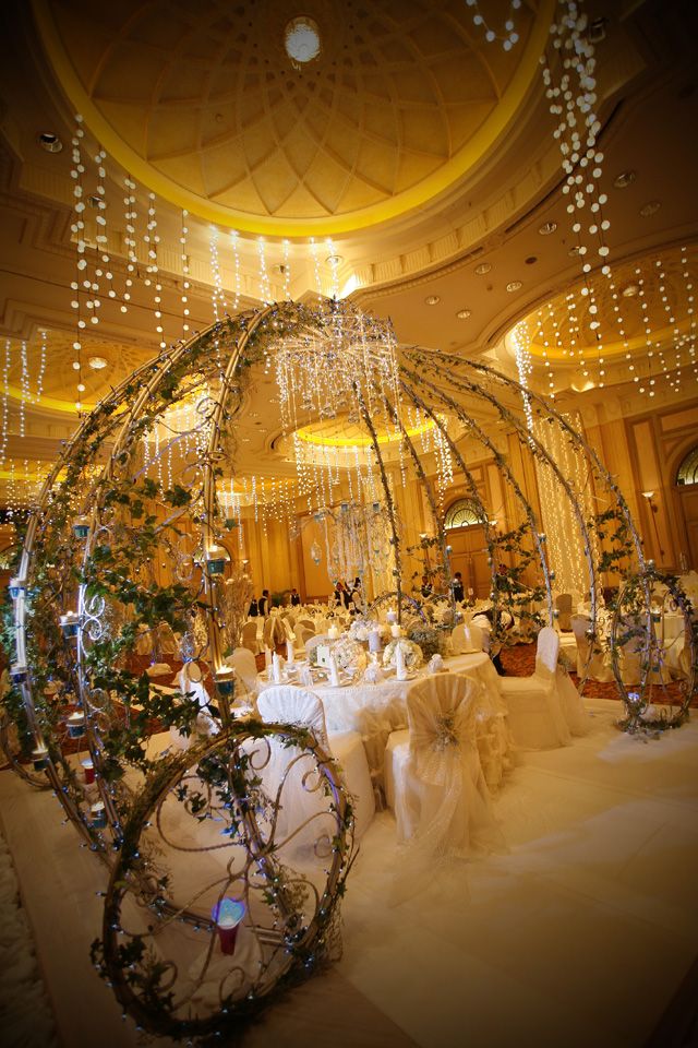 an elaborately decorated banquet hall with chandeliers