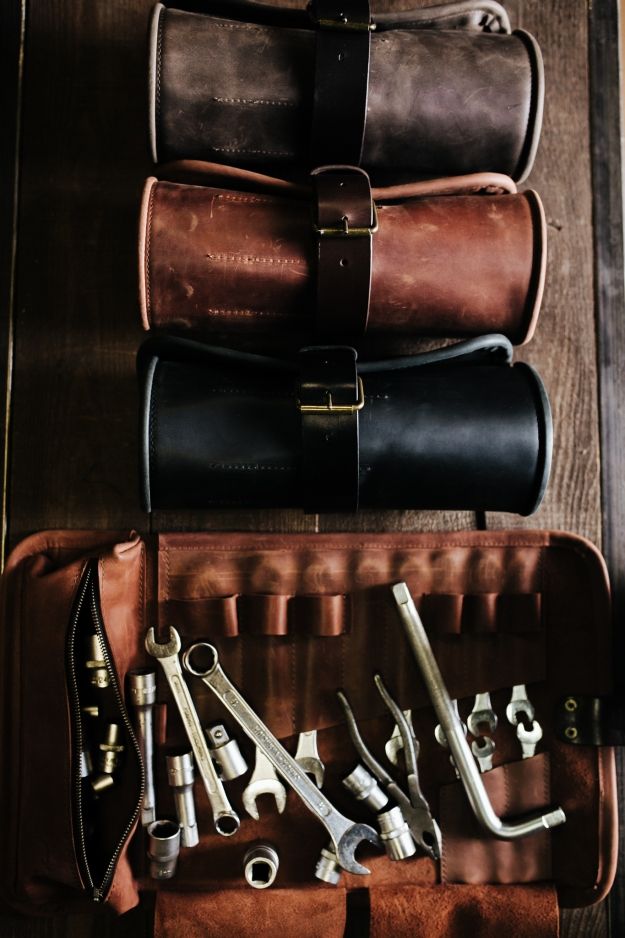 several different tools are in a leather case