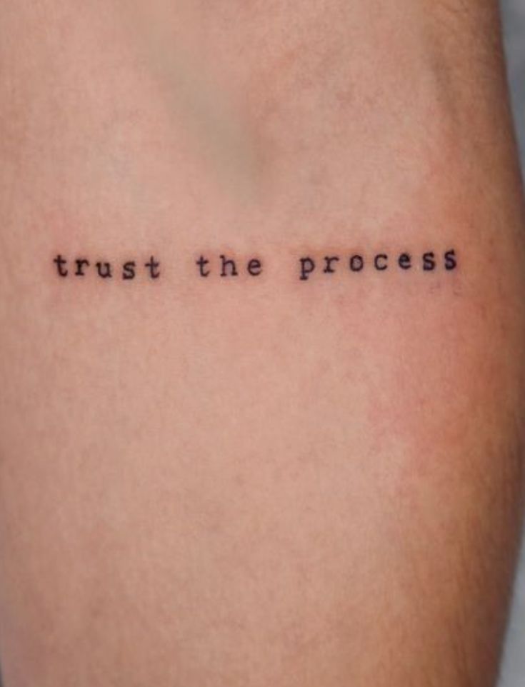 a tattoo that says trust the process on it