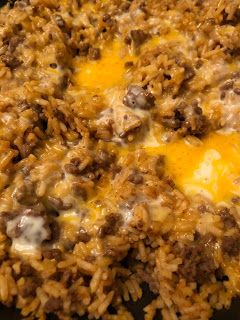 a casserole dish with ground beef and cheese on the top is ready to be eaten