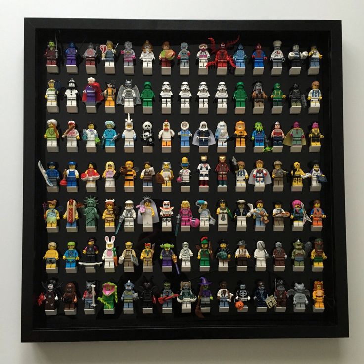 a display case filled with lots of lego minifigure action figures in different colors and sizes