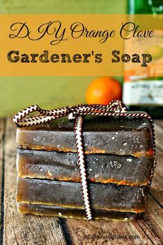 an orange grove gardener's soap on a wooden table with the words diy orange grove