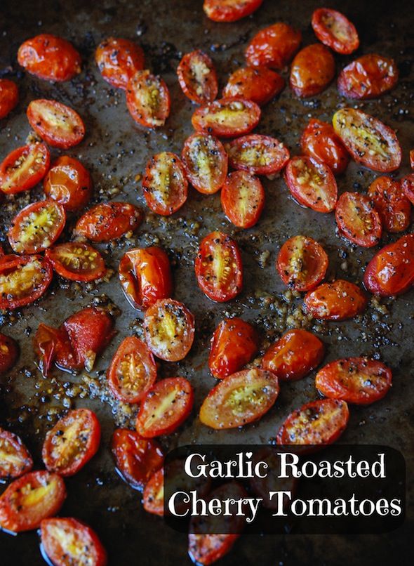 garlic roasted cherry tomatoes in a skillet with text overlay that reads garlic roasted cherry tomatoes