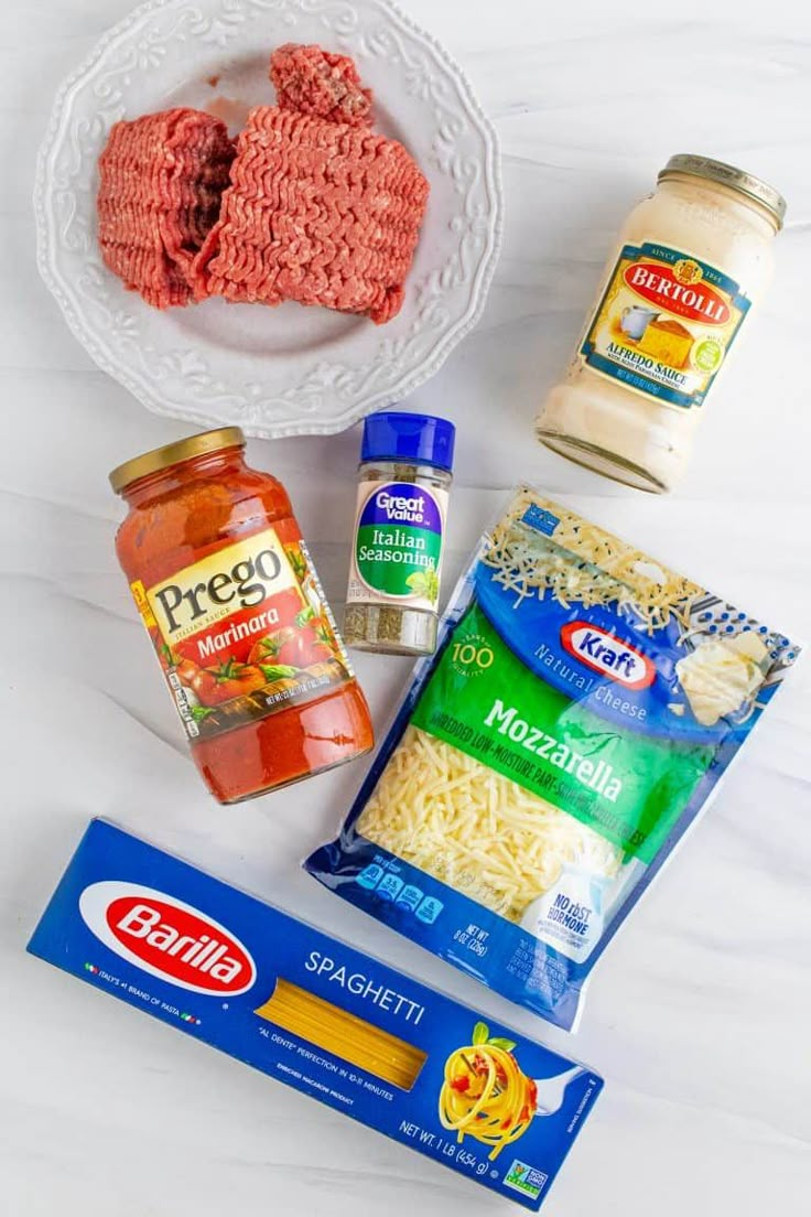 ingredients to make pasta on a white table