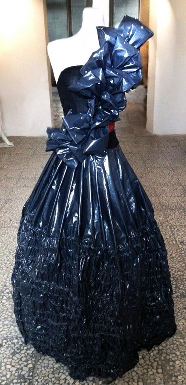 a dress made out of plastic sitting on top of a mannequin