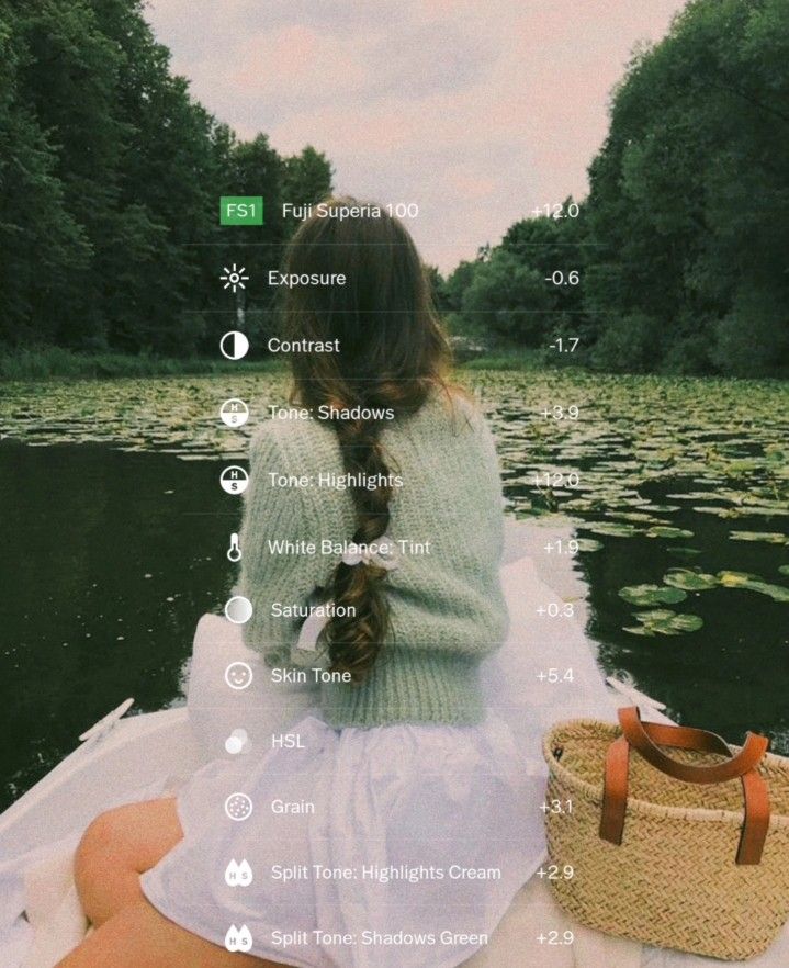 a woman sitting on top of a boat next to a lake filled with water lilies