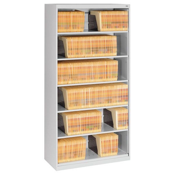 a metal shelf with baskets and bins on the bottom, in front of a white background