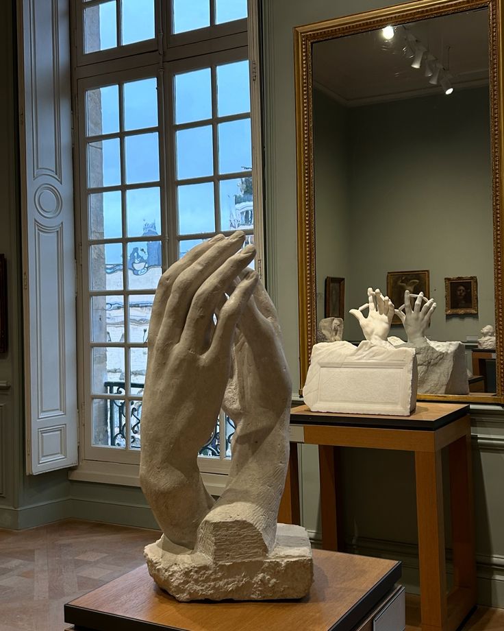 a sculpture is shown in front of a window