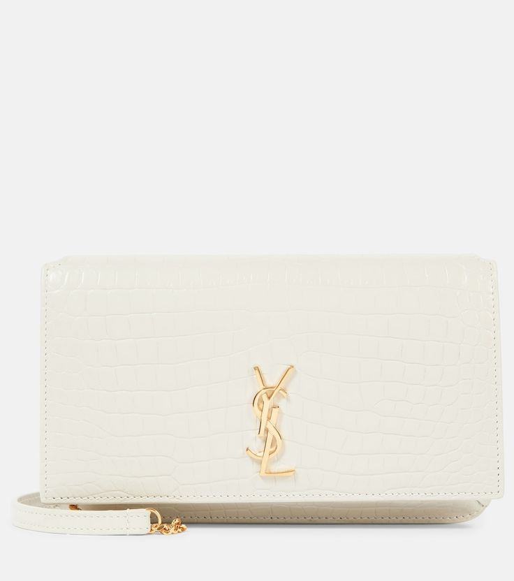 Cassandre Leather I Phone Crossbody Bag in White - Saint Laurent | Mytheresa White Crossbody Bag Outfit, Crossbody Bag Outfit, Leather Phone Pouch, Bridal Handbags, White Crossbody Bag, Bag Outfit, Bridal Bag, Bridal Clutch, Wedding Bag