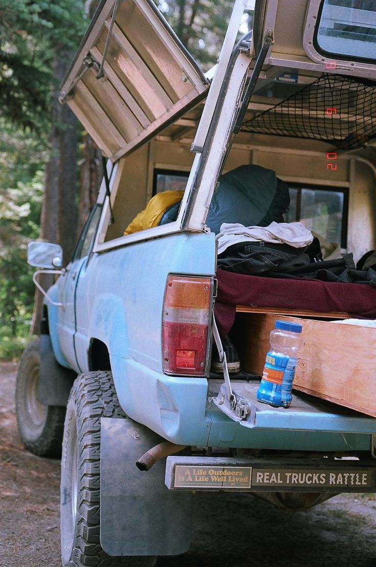 the back end of a pick up truck filled with items