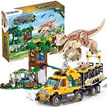 a toy truck with dinosaurs on it and a lego box in front of the model