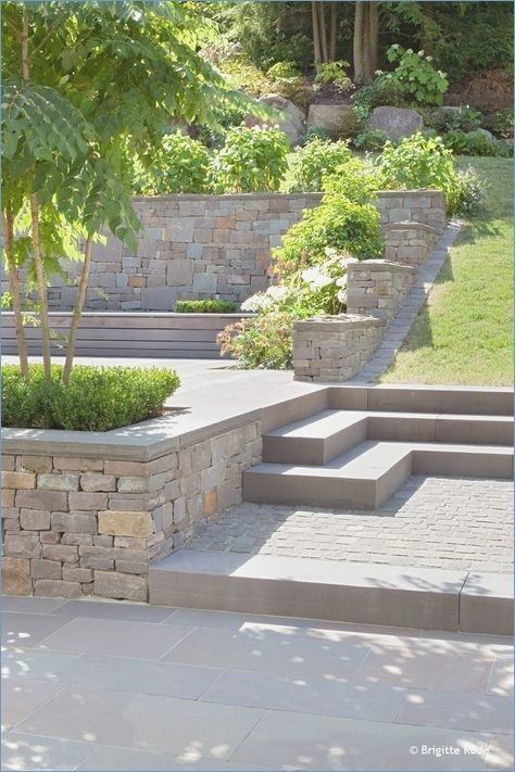 an outdoor patio with steps and trees