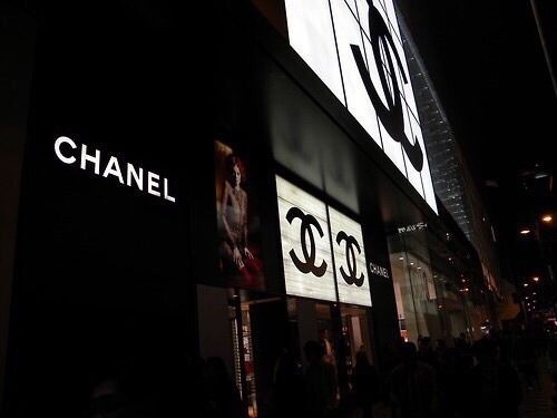 the chanel store is lit up at night