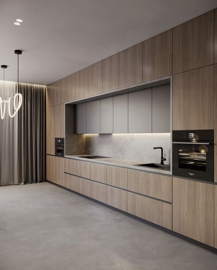 a modern kitchen with an oven, sink and countertop is shown in this image