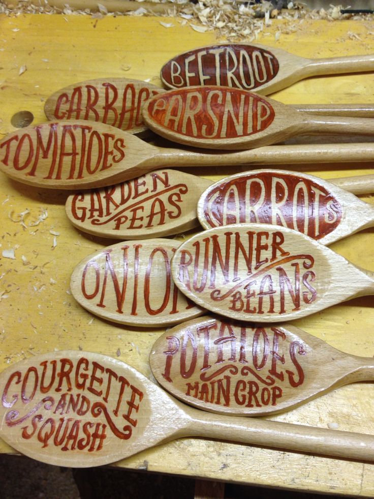 wooden spoons with different types of words on them