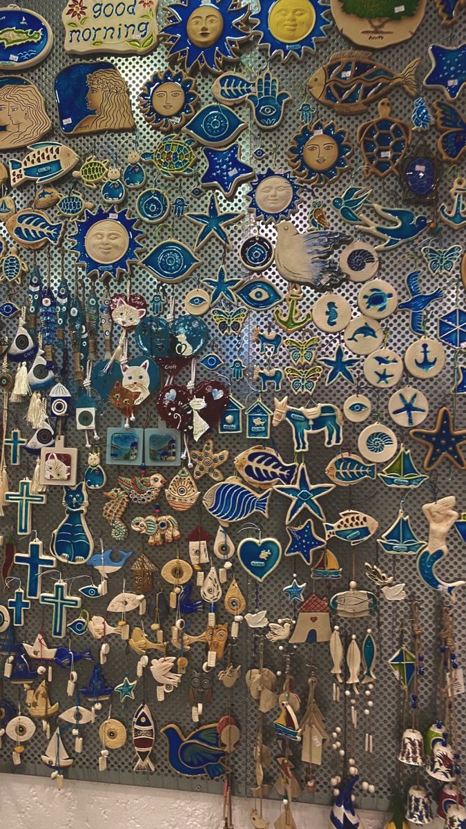 a wall covered in lots of different types of buttons and magnets on it's side