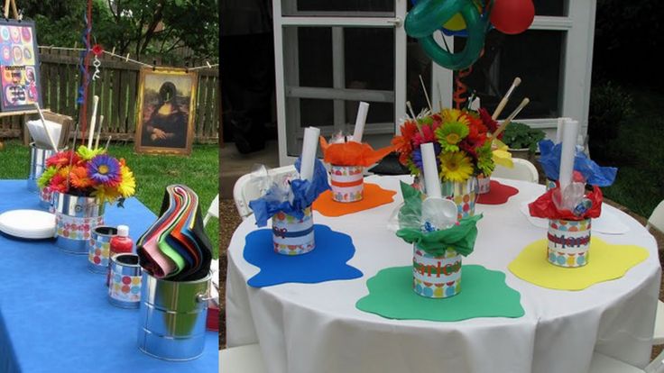 the table is set up with cupcakes and decorations for an outdoor birthday party