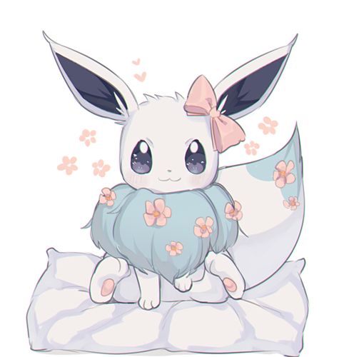 a cute little bunny sitting on top of a pillow