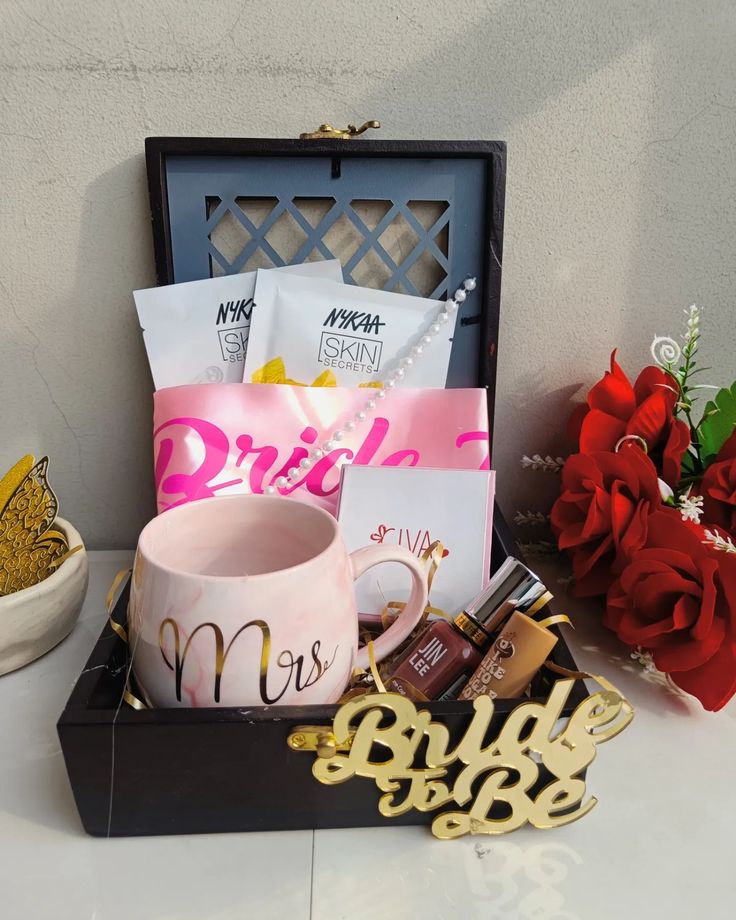 a gift box filled with personalized items including a coffee mug, lipstick, and flowers