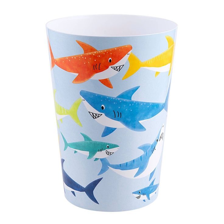 a paper cup with different colored sharks on it