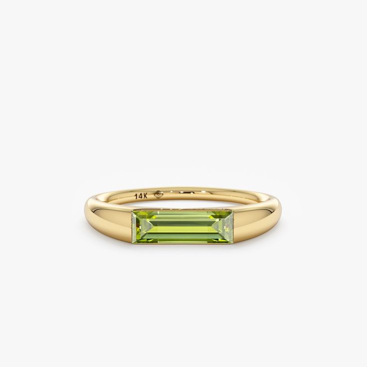 Capture the essence of August with the Natural Peridot Ring, a radiant symbol of summer's warmth and vitality. Crafted in your choice of 14k or 18k solid gold, this ring showcases a vibrant green peridot, the birthstone for August, elegantly displayed in a modern channel setting. Its understated design and timeless beauty make it a perfect addition to any jewelry collection. - Handmade - Solid Gold - Natural Peridot - Total Peridot Carat Weight: 0.93 ctw - Height of the Setting: 2.9 mm - Ring Thickness: 3.47 mm 🛠 Your Sarah Elise piece is handcrafted with care! Ready-to-ship items go out within 3 business days. Made-to-order pieces typically take 7-10 business days to create. If you need something sooner, please contact us - we'll see if we can make it happen! For estimated shipping dates Ring Baguette, Solid Gold Bracelet, Channel Setting, August Birthstone, Beautiful Gift Wrapping, Initial Ring, Peridot Ring, Name Jewelry, Initial Jewelry