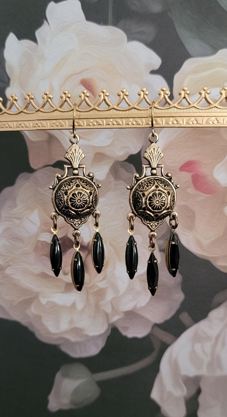 Be memorable with these eye-catching earrings.   Thoughtfully designed with beautiful antique golden brass metalwork  featuring lovely Swarovski black glass crystals and vintage cabochons etched in black and gold .       All materials sourced from the United States, Italy, Portugal, Spain and The United Kingdom. All jewelry is free of lead and  free of nickel.  All my jewelry is made and designed with love for you to express yourself and your life with happiness, beauty and spirit. Luxury Vintage Jeweled Earrings, Luxury Gold Victorian Chandelier Earrings, Luxury Victorian Gold Chandelier Earrings, Luxury Victorian Earrings With Intricate Design, Black Antique Earrings, Luxury Victorian Baroque Earrings, Antique Jewelry Victorian Earrings, Luxury Victorian Chandelier Earrings For Formal Occasions, Luxury Victorian Jewelry For Vintage Events