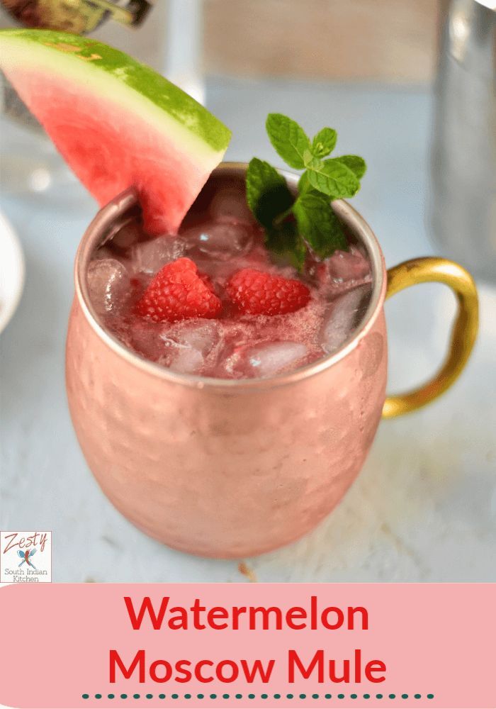 watermelon moscow mule with mint garnish in a copper mug