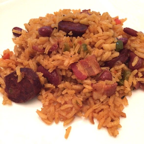 rice with sausage and beans on a white plate