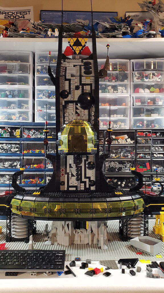 there is a clock made out of legos in the store with other items on display