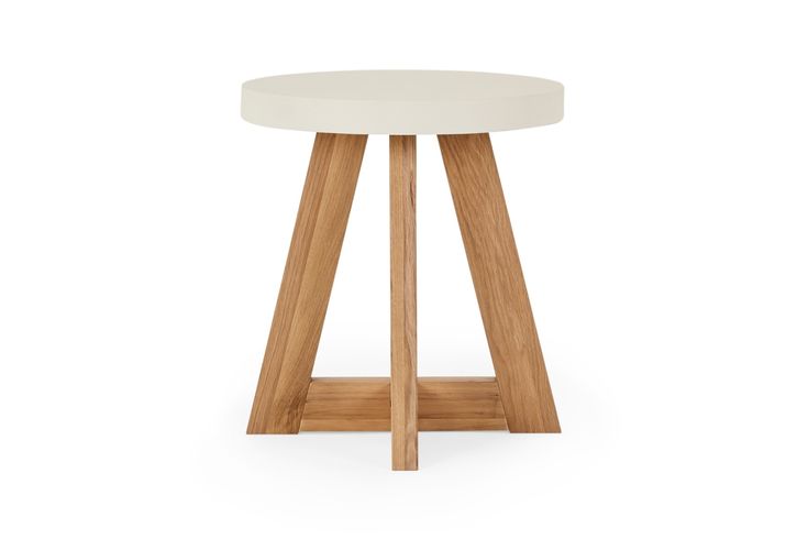 a white stool with wooden legs and a round seat on the bottom, against a white background