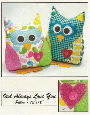 two stuffed owls sitting next to each other on top of a white sheet with the words owl always love you written in it