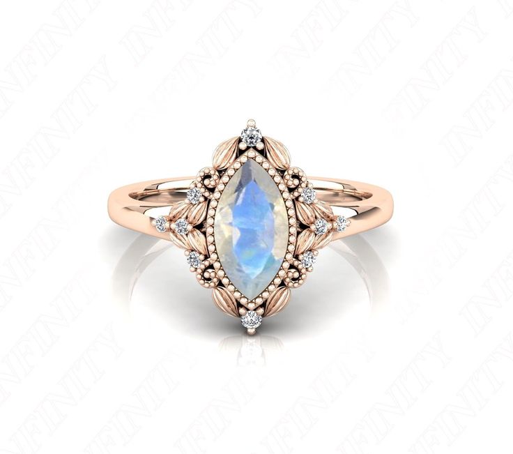 an 18k rose gold ring set with a pear shaped opal and diamond accents