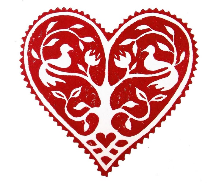 a red heart with birds and flowers on it