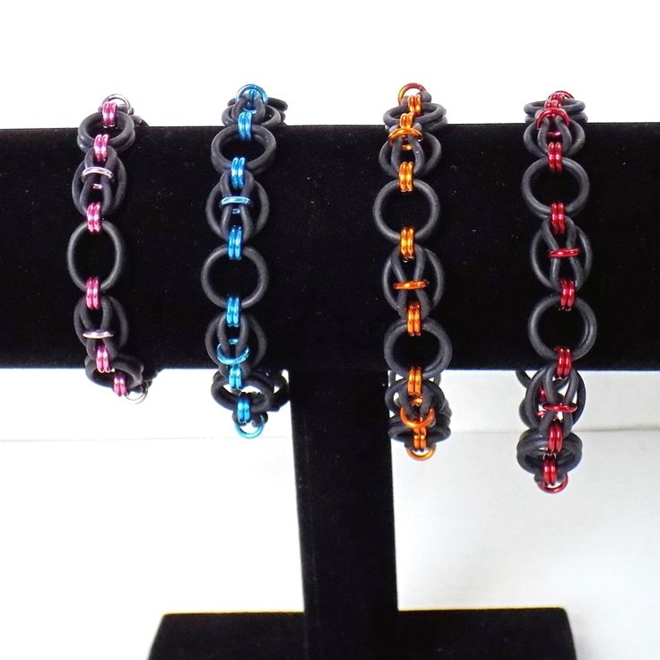 "Rubber stretchy chainmaille bracelets in an original unique pattern I named dragon eyes. Made with black EPDM rubber rings and colored anodized aluminum rings. Slip on style stretches over the hand, no clasp, due to the stretchy nature the sizing is approximate. Nickel free jewelry Small fits wrist up to 6.5\" inches Medium fits wrists up to 7.5\" inches Large fits wrists up to 8.5\" inches **more colors available by custom order, other sizes available up on request | Rubber Chainmaille Stretch Chainmaille Jewelry Patterns, Chainmail Patterns, Eyes Pattern, Dragon Eyes, Chainmaille Jewelry, Chainmail Jewelry, Chainmaille Bracelet, Handmade Chain, Nickel Free Jewelry