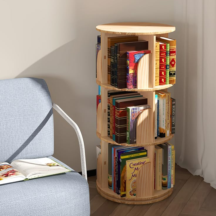 there is a book shelf with many books on it next to a chair and window