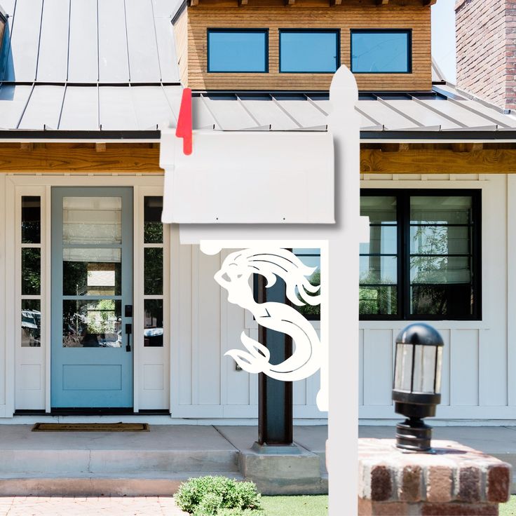 a white sign sitting in front of a house next to a parking meter and mailbox