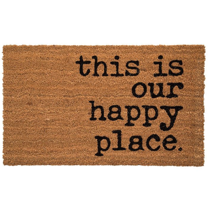 a door mat that says, this is our happy place with black lettering on it