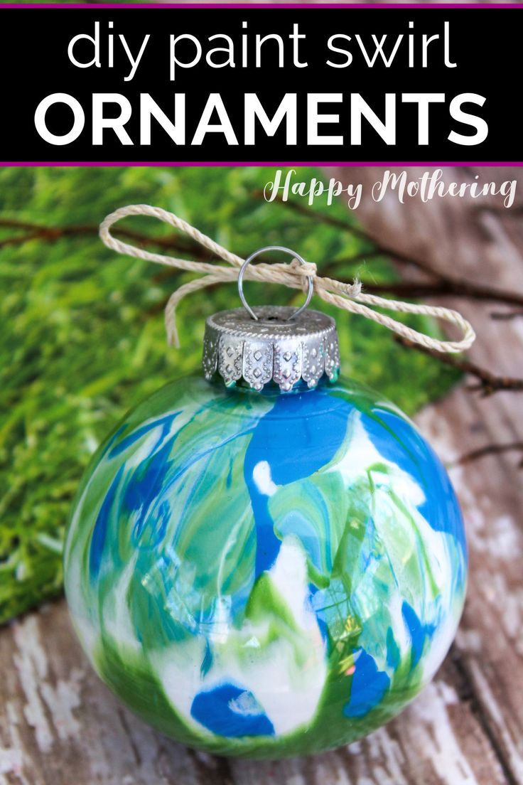 an ornament with the words diy paint swirl ornaments happy mothering on it