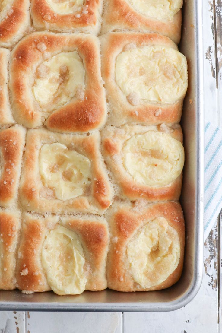 a pan filled with bread and bananas on top of a table