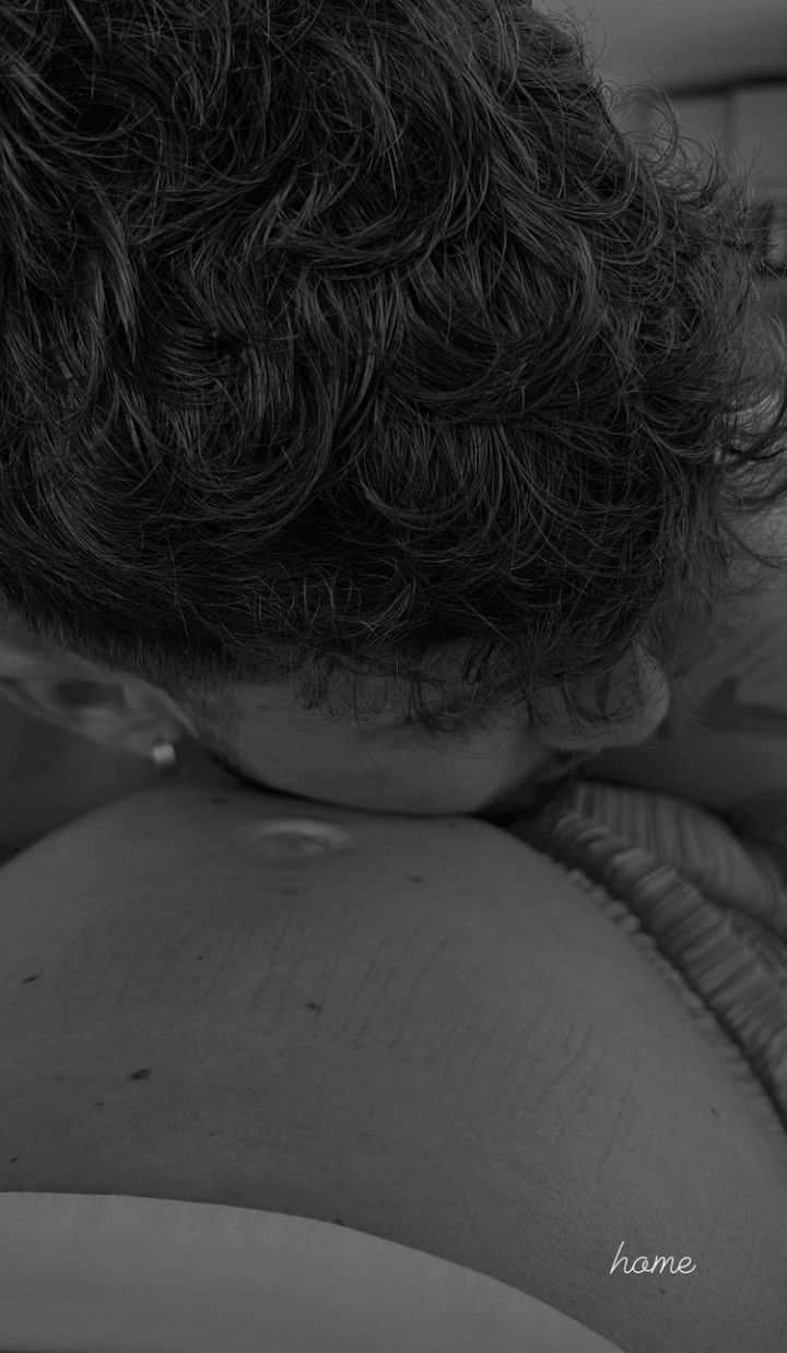 the back of a woman's head with curly hair