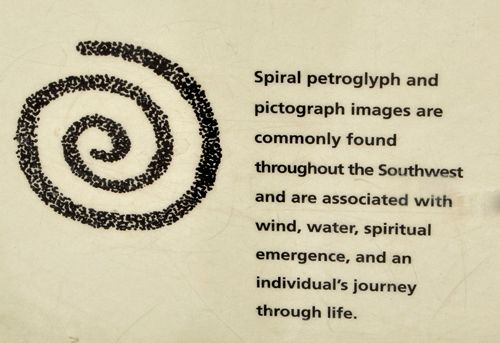 a poem written in cursive writing on a piece of paper with an image of a spiral